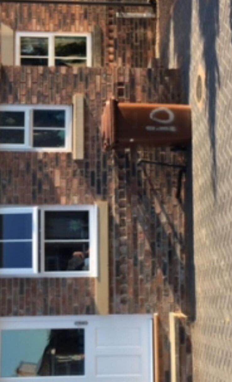 Brick house extension with new windows fitted during construction
