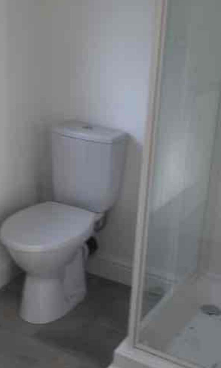 Newly installed bathroom with WC and shower enclosure